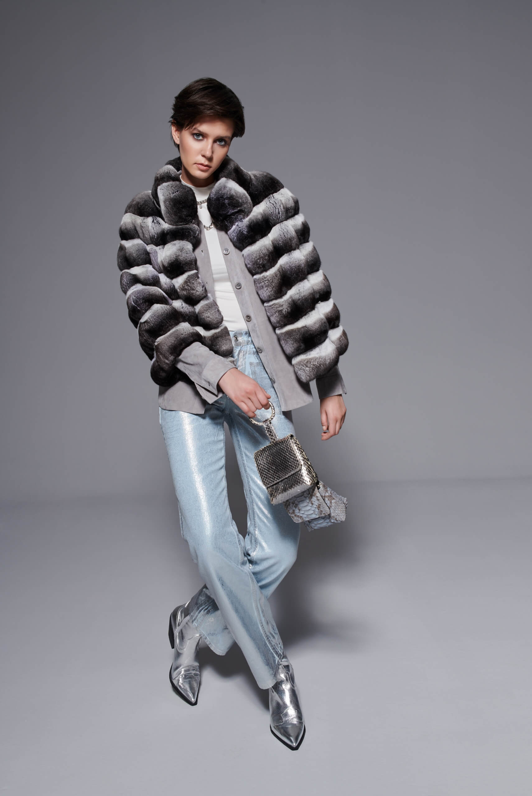 a woman in a real authentic fur chinchilla coat