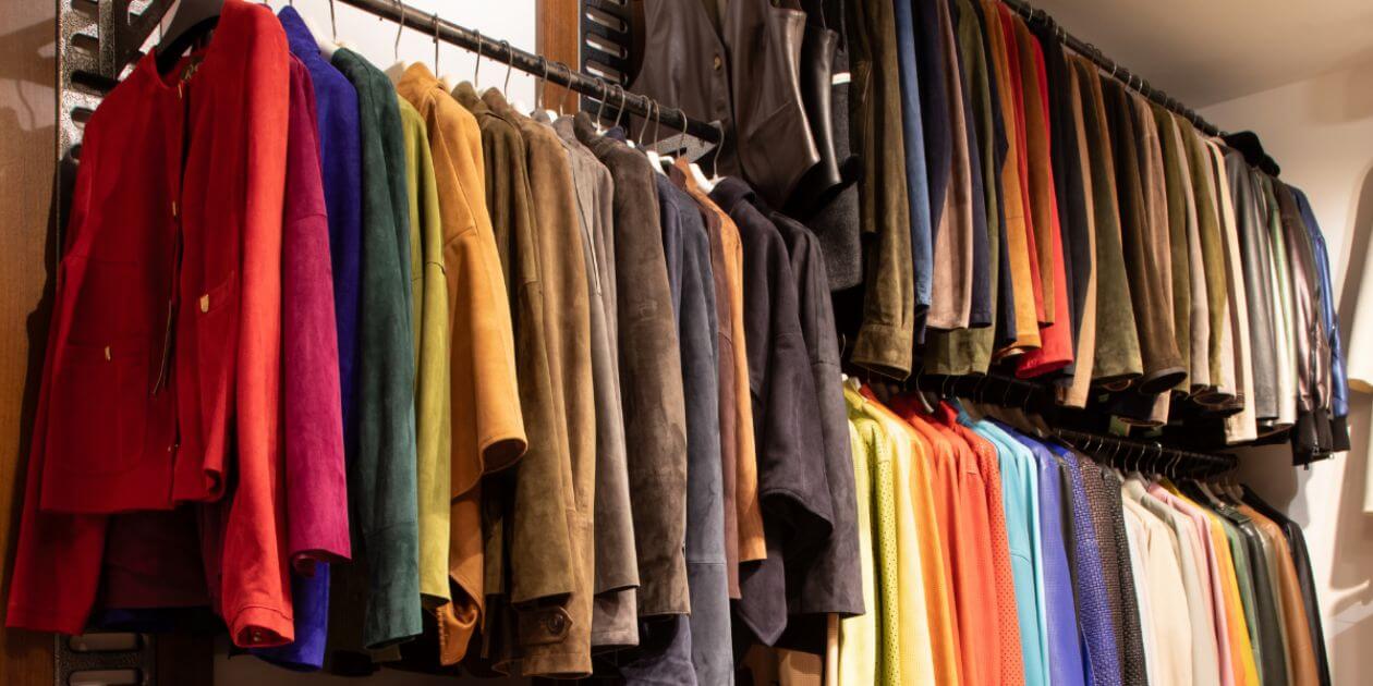 a group of leather jackets on a rack
