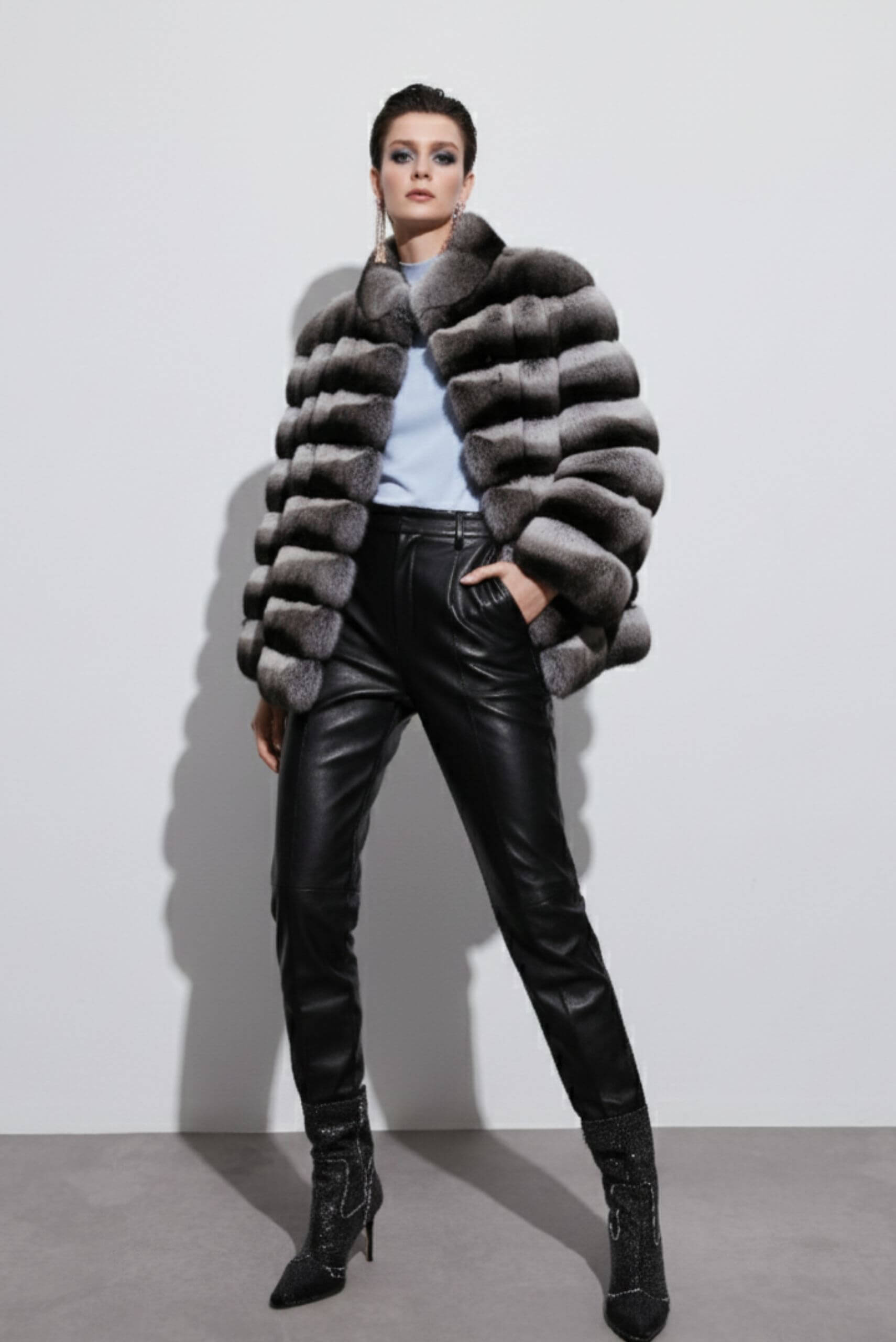 Grey and black striped fur coat displayed in an Istanbul boutique – part of a luxury shopping guide for exclusive fur fashion.